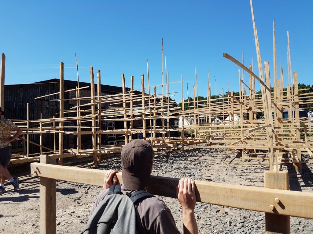 Photo of students looking onto timber structures